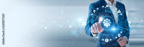 IT support specialist pointing at Technical Support and networking helpdesk data systems, troubleshooting solutions, customer assistance platforms, system maintenance, service management tools
