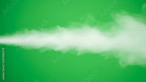 A thick white cloud of vapor moves horizontally across a solid green background