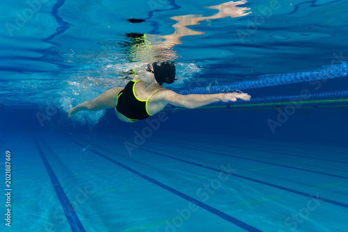 Underwater Photo of Young Female Athlete Swimming in Pool