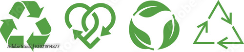 Recycling symbols featuring various green arrow and leaf designs represent sustainable practices and environmental consciousness.