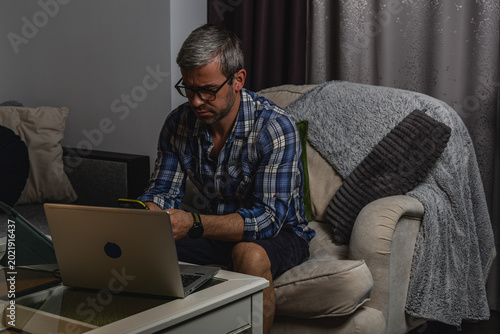 Frustrated man reacting to smartphone notification