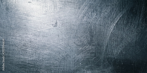 Foto Textured metallic surface, exhibiting subtle scratches and imperfections, which adds a sense of history and depth