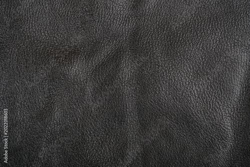 Black leather fabric texture detailed close-up