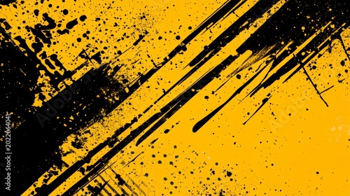 Abstract grunge background with black and yellow paint splatters and streaks.