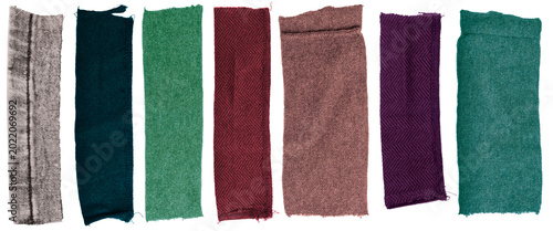 Isolated collection of diffirent scraps of fabric with copyspace on white background