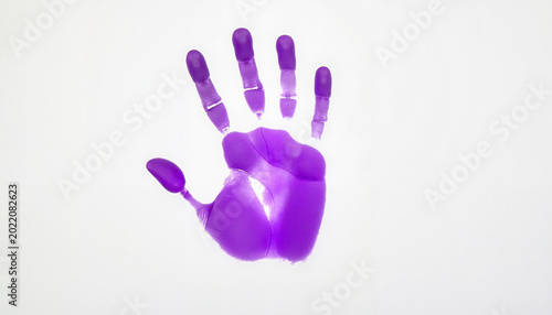 Bright purple handprint on minimalistic background, creative expression