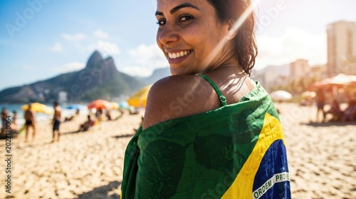 Woman with Brazilian flag on Ipanema Beach, Rio de Janeiro