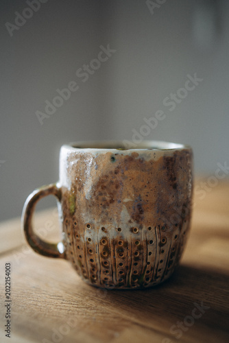 Handcrafted artisan pottery cup.
