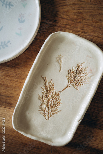 Handcrafted pottery herbarium dish.