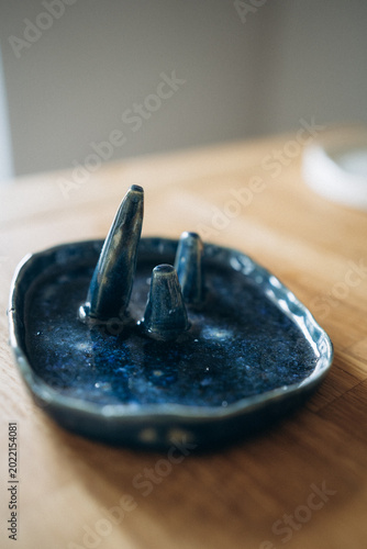 Handmade ceramic ring dish in cosmic galaxy blue with a shiny glitter glaze.