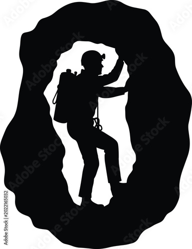 Fotografía Adventurous climber exploring dark cave entrance
