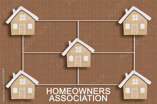 HOMEOWNERS ASSOCIATION CONCEPT WITH CONNECTED RESIDENTIAL HOUSE MODELS - Symbolic representation of community housing and real estate network for HOA and property management themes