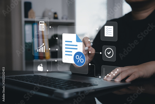 Foto Tax document management concept with financial icons, checklist and analytics on virtual interface above laptop, representing tax compliance, accounting workflow and business reporting