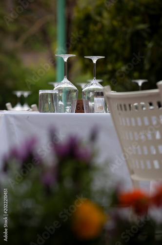 elegantly served outdoor tables in a restaurant, Italy