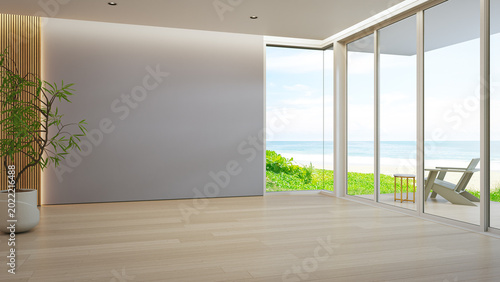 Minimalist living room with cozy armchair and green plant 3d rendering. Blue sky ocean beach view through large glass door of calm interior for vacation relaxation.