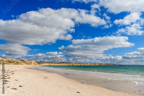 Foto Authentic foreshore landscape at Port Willunga Beach, South Australia, under low dramatic clouds and patches of blue sky