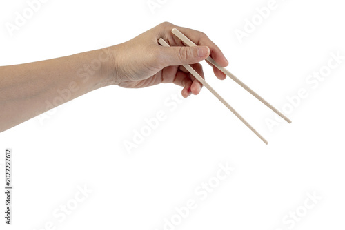Hand holding chopsticks isolated on a transparent background