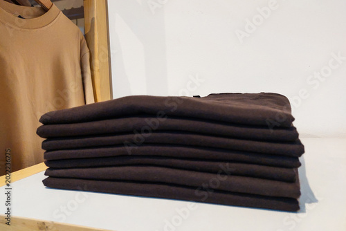 Fotografie Black t-shirt folded in the wardrobe