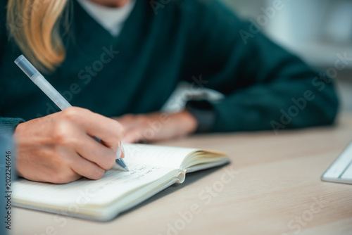 Fotografi Young woman mindfully journaling and reflecting in her notebook, embracing self-