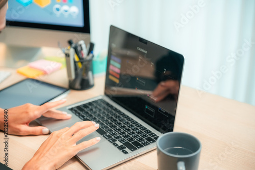 Modern woman freelancer working from home office using digital tablet, remote work and productivity lifestyle