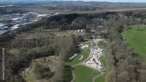 aerial drone shot of commercial plantation community woodland transformation project conifer woodland spruce pine treetops cloudy day