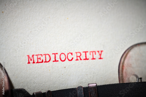 Фотография mediocrity text written with a typewriter