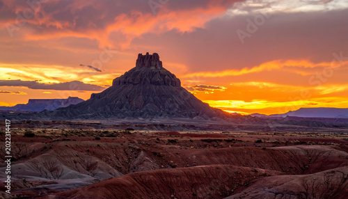 Majestic Desert Butte Under a Vibrant Sunset Sky