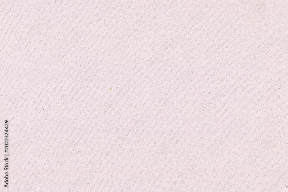 Fototapeta premium Light pink textured paper background with a soft, subtle style