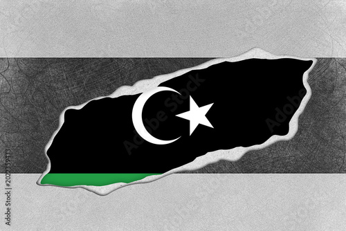 Foto Libyan Flag with Crescent Moon and Star Revealed Behind a Textured Grey and Blac