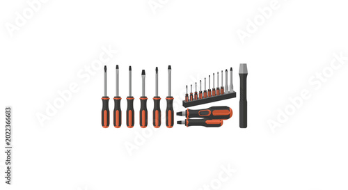 Fotografie A set of orange and black screwdrivers arranged on a white background with various bits and tools