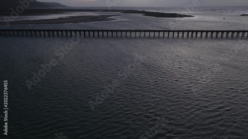 Aerial view of barmouth bridge during a moody cloudy sunset