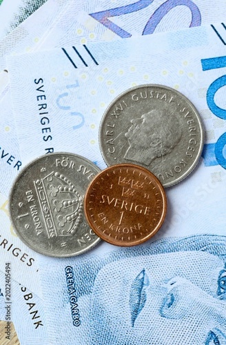 Fotografie Swedish krona money bills and coins on table