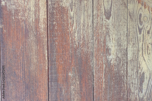 yellow brown wooden texture of pine planks in the wall of the fence