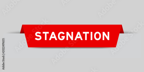 Vászonkép Red color inserted label with word stagnation on gray background