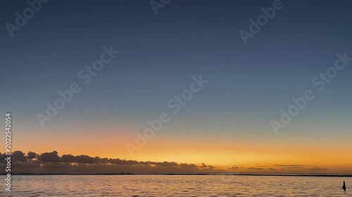 Beautiful Ocean Sunset with Orange Horizon and Calm Waves in 4K