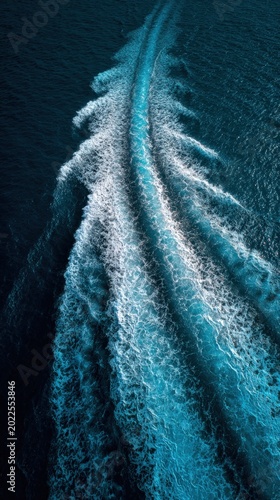A boat's wake carves an intricate pattern on the deep blue sea. A dynamic interplay of water and motion. ..Created with Generative AI, not depicting real subjects.