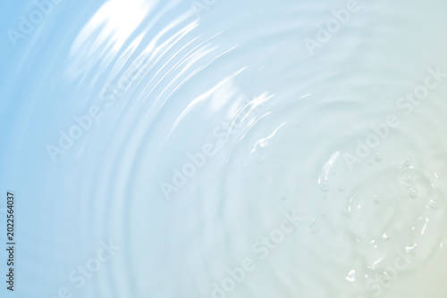 Calming Water Ripples on Soft Blue Background with Light Reflection
