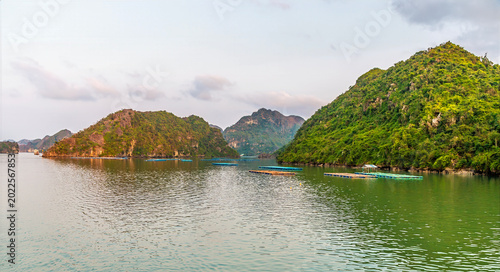 Fényképezés A view of fish farms in Ha Long Bay, Vietnam close to sunset