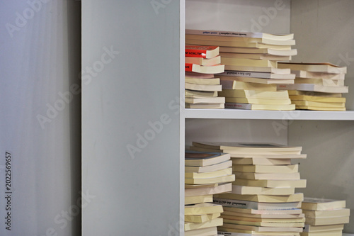 close up view of unrecognizables books arranged in rows