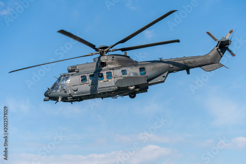 Black painted modern military transport helicopter in Hungary