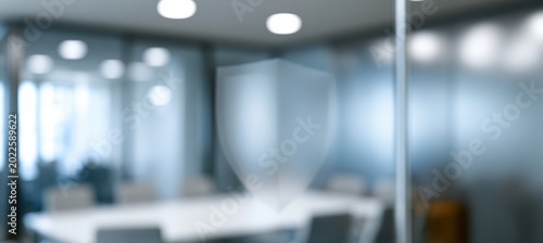 translucent shield shape in business security meeting room