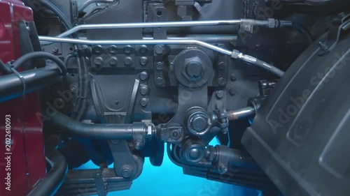 Powerful hydraulic cylinders control additional equipment on the truck. Closeup. Shot in motion