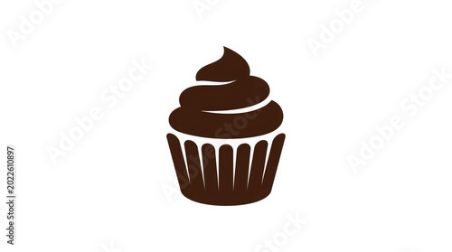 A chocolate cupcake with swirled frosting sits on a plain surface indoors.