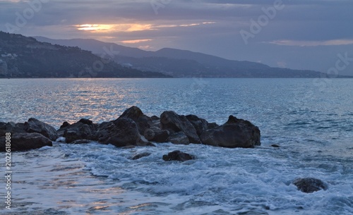 Mediterranean Sea view from Cap Martin with distant mountains and calm water, morning atmosphere