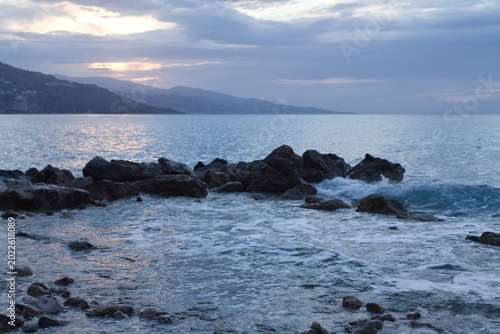 Mediterranean Sea view from Cap Martin with distant mountains and calm water, morning atmosphere