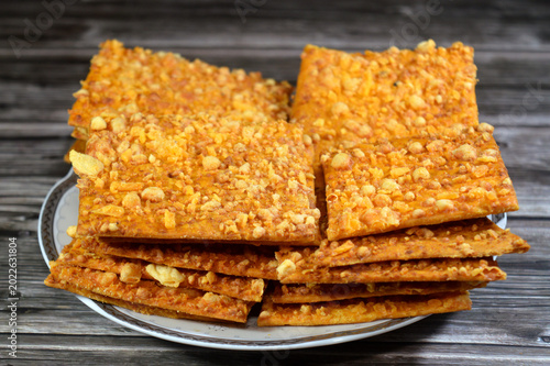 Картината върху платно plate of Roumi cheese crackers, savory Egyptian snack known for its sharp, salty