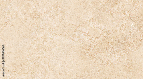 Foto A detailed shot of a beige stone wall with natural textures and patterns