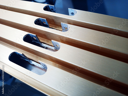 aluminum facade profile with inset hinge holes. furniture parts in production.