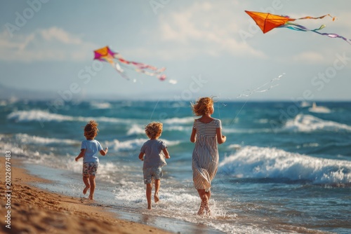 Family with Kids Flying Kites at the Beach in Summer