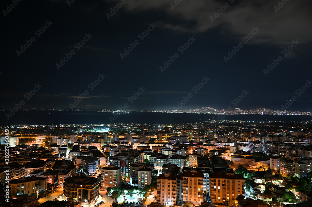 Fototapeta premium Izmir coastal skyline at night, city lights panorama